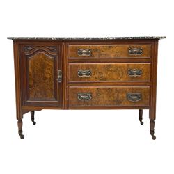 Late 19th century walnut washstand, black and white veined marble top over cupboard and three drawers, turned supports with castors