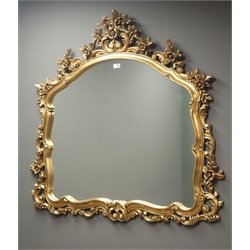  Ornate gilt scroll framed arched mirror, W112cm, H117cm  