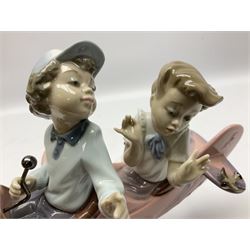 Lladro figure, Don't Look Down, modelled as a girl and boy in a plane, sculpted by Joan Coderch, no 5698, year issued 1990, year retired 2004, H17cm