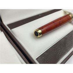 Circa 1930s Mentmore Auto Flow button fill fountain pen, the black barrel and cap with single narrow band and gold nib stamped Osmi Ridium 14ct, together with two gold nib fountain pens, each marked Huahong, the first stamped 14K 580, and second stamped 8K, both housed in Mentmore boxes (3)