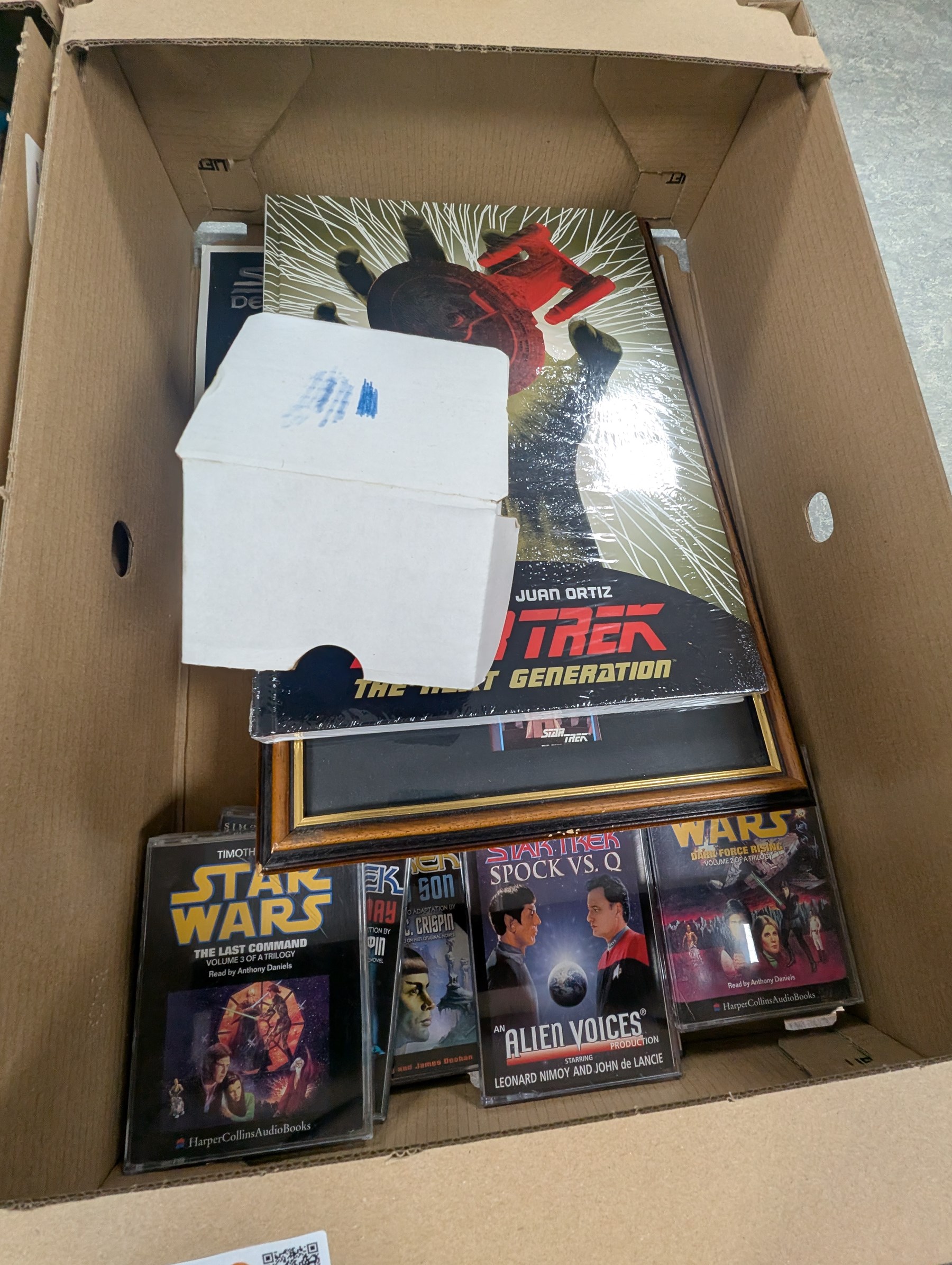 Large collection of Sci-Fi books and ephemera, including Star Wars, Star Trek and Doctor Who novels, in four boxes