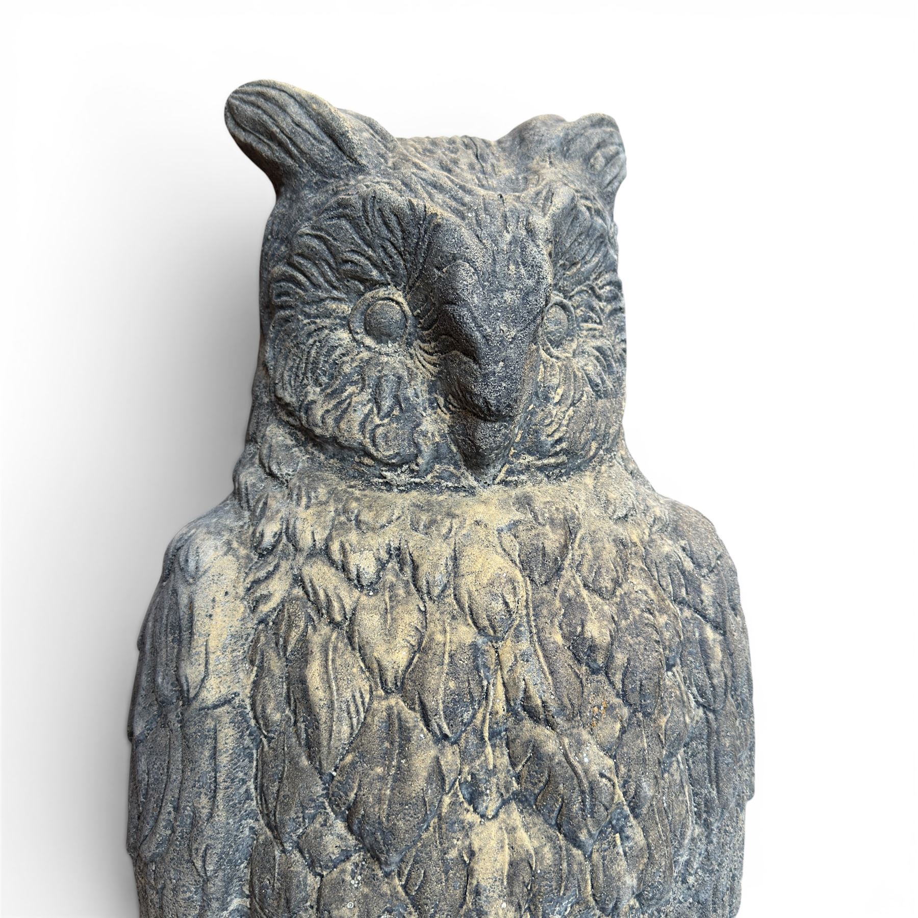 Pair of large composite stone garden statues modelled as standing horned owls, raised on circular bases
