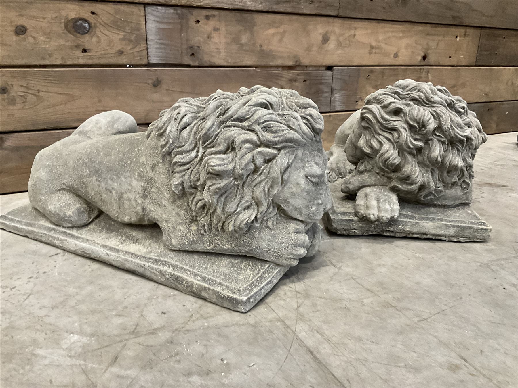 Pair of small recumbent garden lions