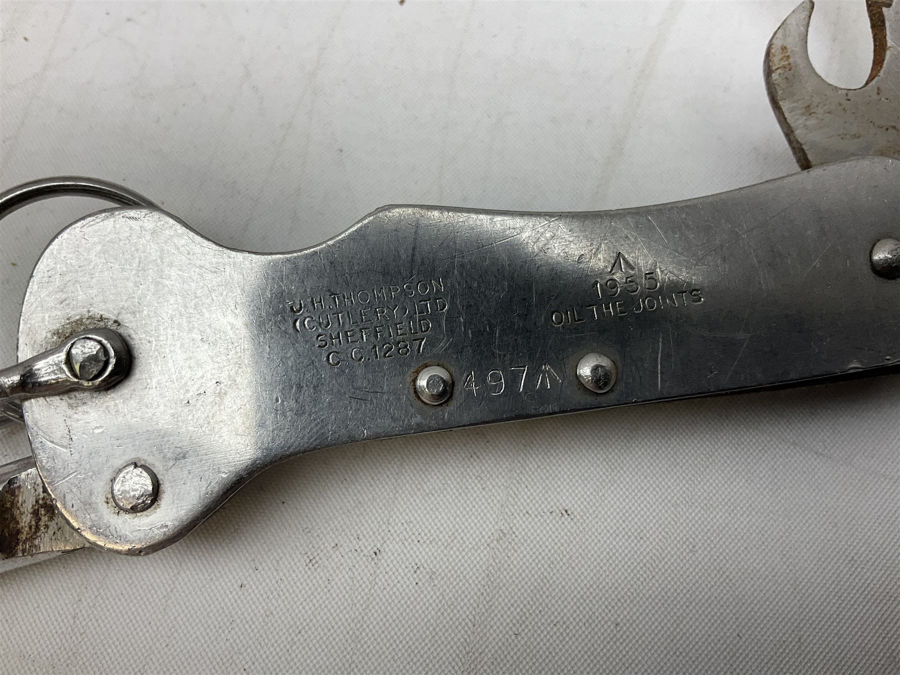 British Pattern 1876 socket bayonet with 43cm steel triangular blade L52cm overall; another socket bayonet with cruciform blade; No.4 Mk.II spike bayonet in metal scabbard with webbing frog; and 1955 Army jack knife by J.H. Thompson Sheffield (4)