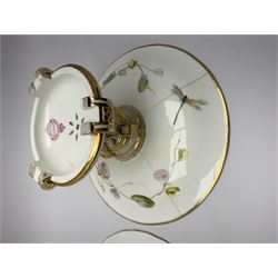 19th century Minton dessert service, comprising four comports, one tazza, and twelve plates, each hand painted with birds perched upon branches, and further detailed with insects and heightened in gilt, with printed retailers mark beneath for John Mortlock Oxford Street London, and impressed Minton mark to most, comport H13.5cm, plates D23.5cm. 
