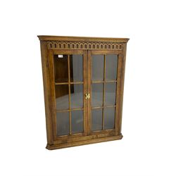 Oak corner cabinet with arcade frieze