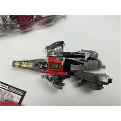 Four 1980sTransformer G1 - Optimus Prime 1984; DinoBot Sludge (Diplodocus) 1984; Cyclonus 1986; and Runamuck 1986; with paperwork; seven Bandai Robo Machines Robots/Transformers; almost fully stocked Panini Sticker album; two annuals; three comics; two posters; and Ladybird story book