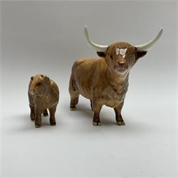 A Beswick model of Highland cow model no 1740, H13cm, and Beswick model of a Highland calf model no 1727d, H7.5cm, both with printed mark beneath.
