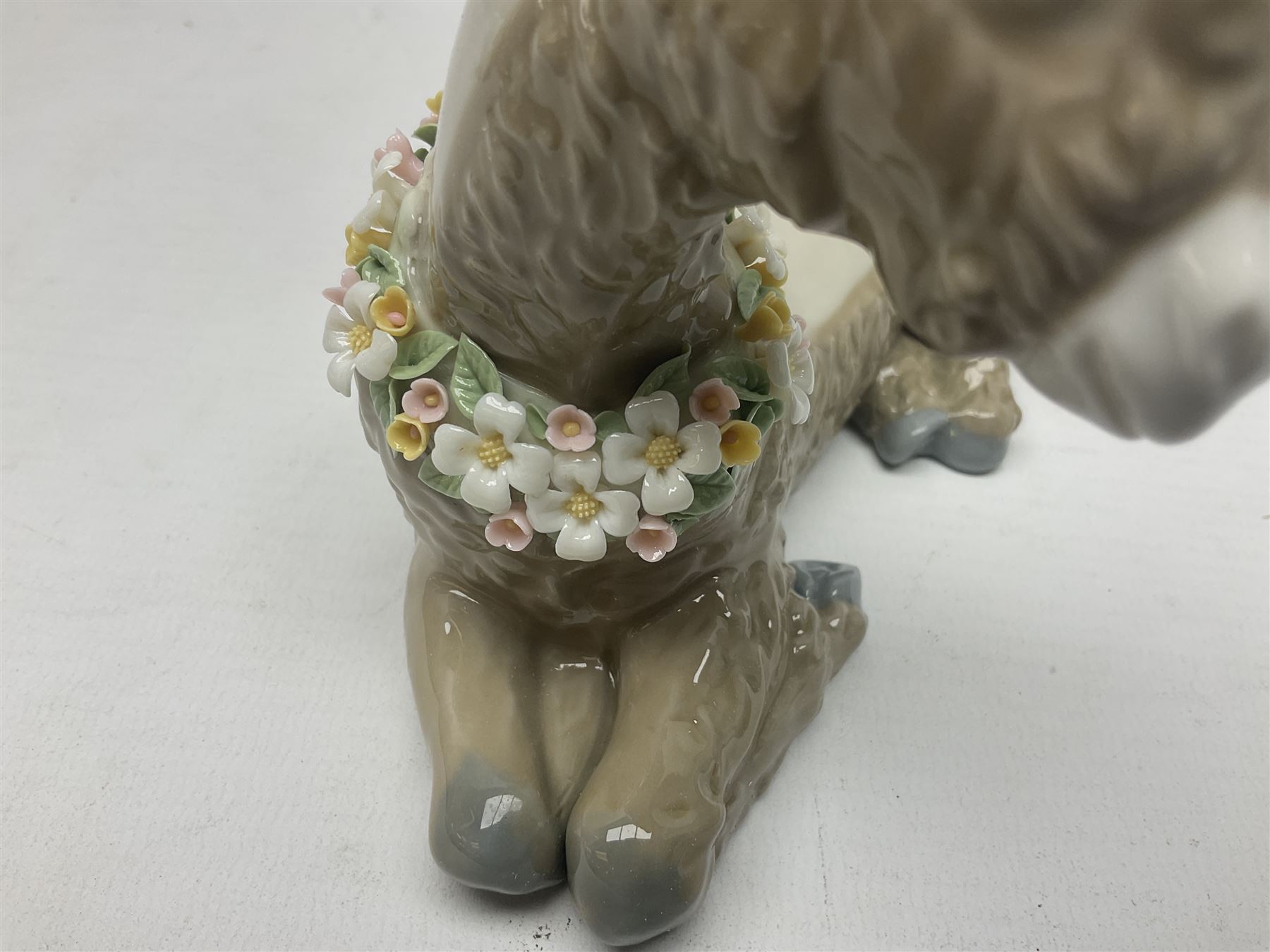 Lladro figures of animals, comprising Mini Lion no 5436, Beautiful Burro no 5683, Hawk Owl no 5422, Beagle Puppy Sitting no 1071, Duck Flying no 1264, Miniature Cat no 5308 and Small Papillon Dog no 4749, four with original boxes, largest example H14cm