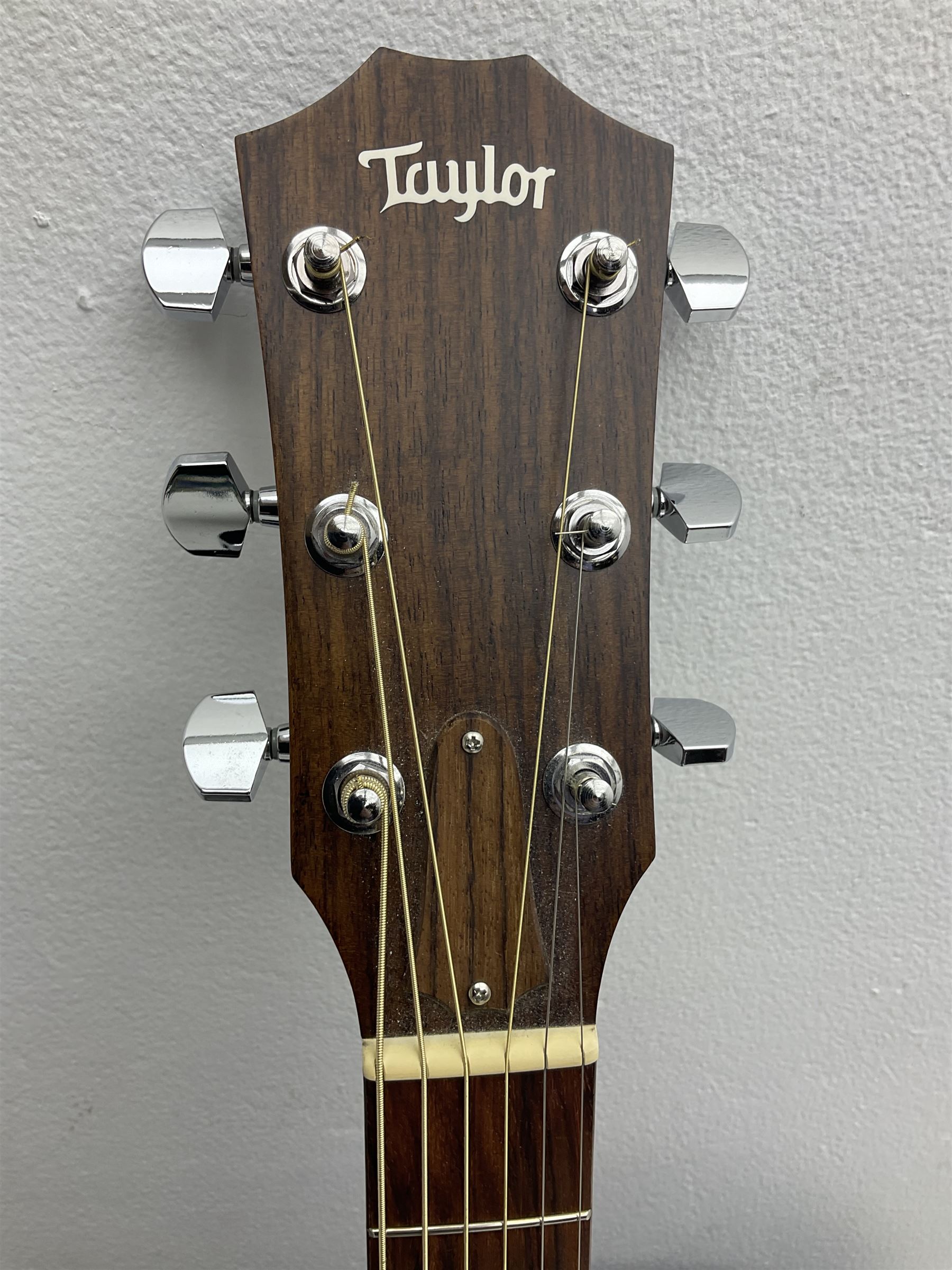 2008 Taylor Model 114 acoustic guitar with mahogany back and ribs and spruce top, serial no.20080825837, L104.5cm; in Taylor hard carrying case with paperwork