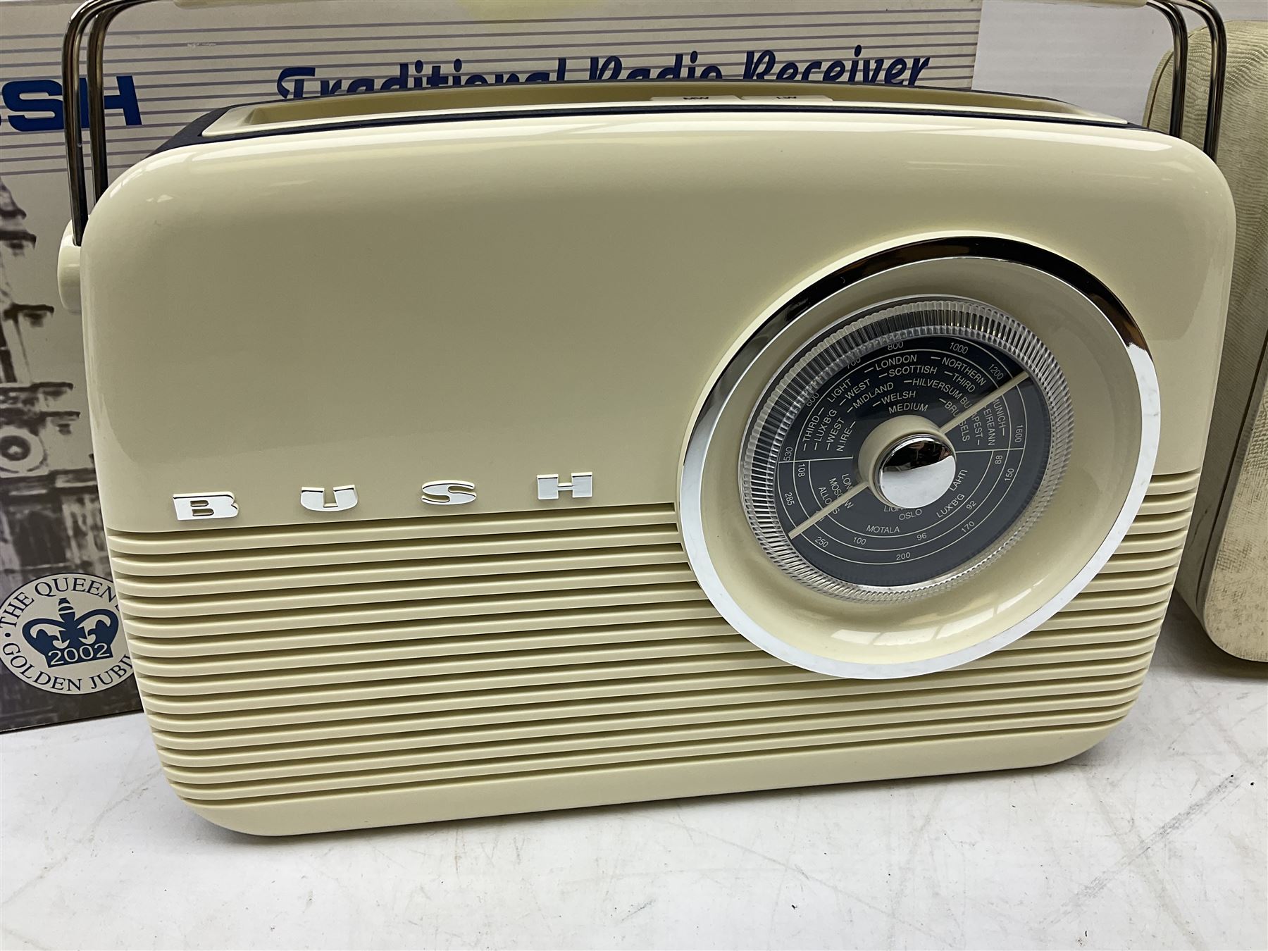 1950s Pye Type P43 cabinet radio in cream Bakelite case with orange knobs, W30cm H22cm D16cm, together with Ever Ready Sky Queen portable radio, Ekco portable radio in red case, Boxed Bush Special Edition 2002 Queens Golden Jubilee radio, Hacker Herald VHS radio (5)