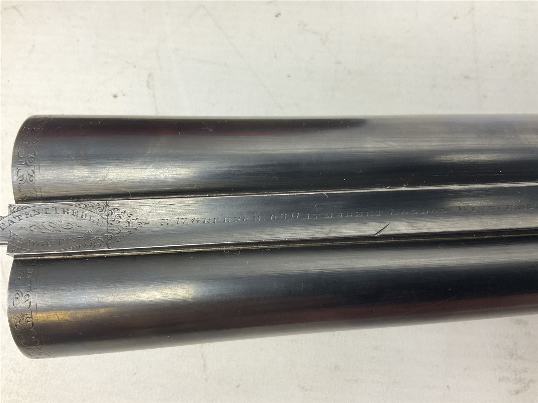 W.W. Greener 12-bore side-by-side double barrel non-ejector shotgun, with 76cm barrels, side safety, engraved lock, figured walnut stock with chequered grip and fore-end, no.33408, 120.5cm overall; in fitted canvas covered case with tools and accessories including .22 12-bore dog training device. SHOTGUN CERTIFICATE REQUIRED.