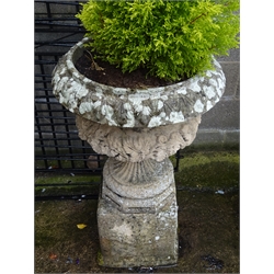  Pair composite stone garden urns, bodies relief decorated with scrolls and leafage on octagonal supports and square moulded bases, D60cm, H100cm, (2)  