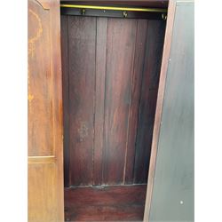 Edwardian inlaid mahogany wardrobe, projecting moulded cornice over central bevelled mirror glazed door, panelled uprights inlaid with trailing bellflowers and foliate decoration, the skirted base fitted with single drawer 