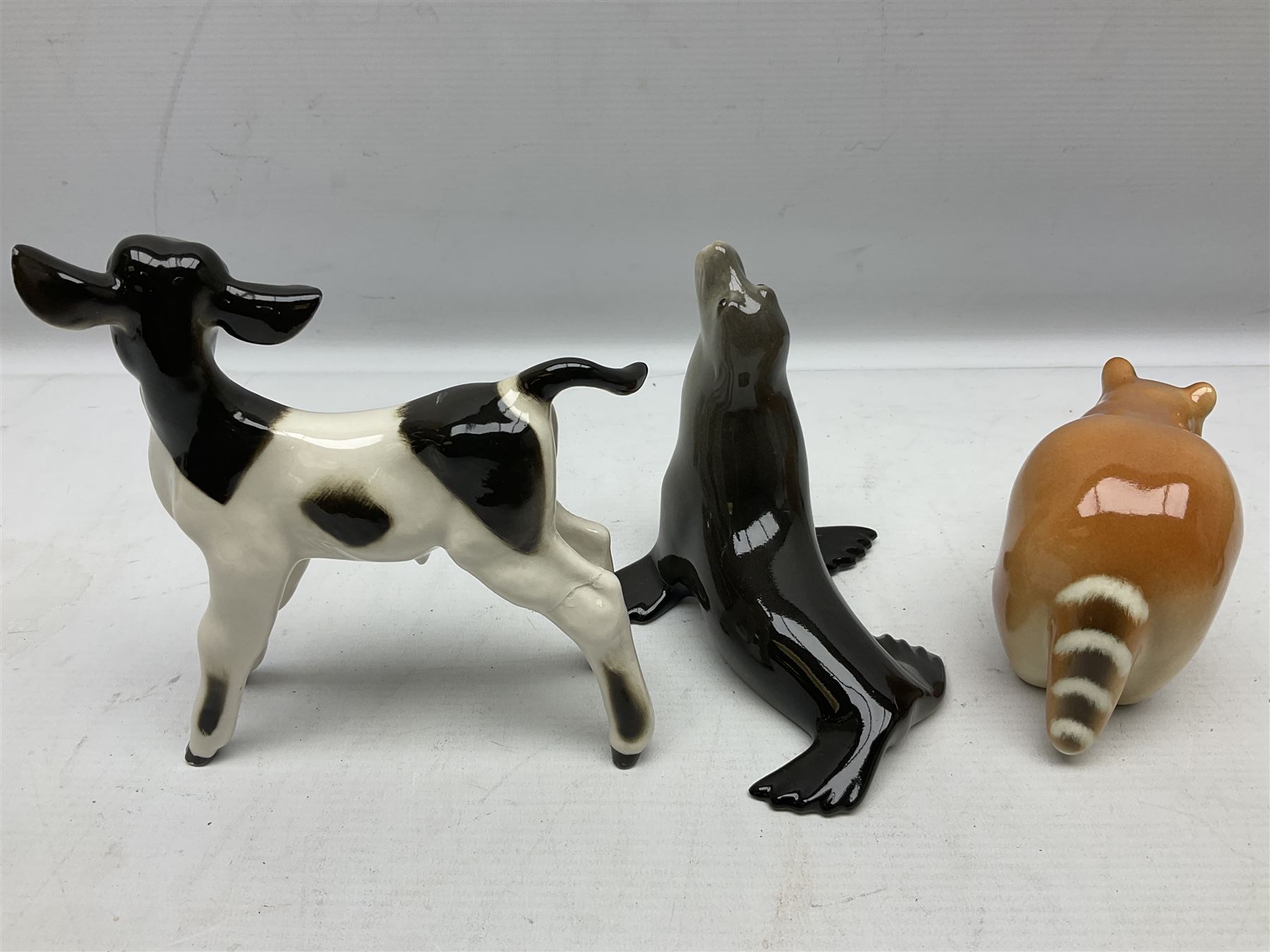 Collection of Russian Lomonosov USSR animal figures, to include  lynx, tiger, red panda, sealion, panada, etc 