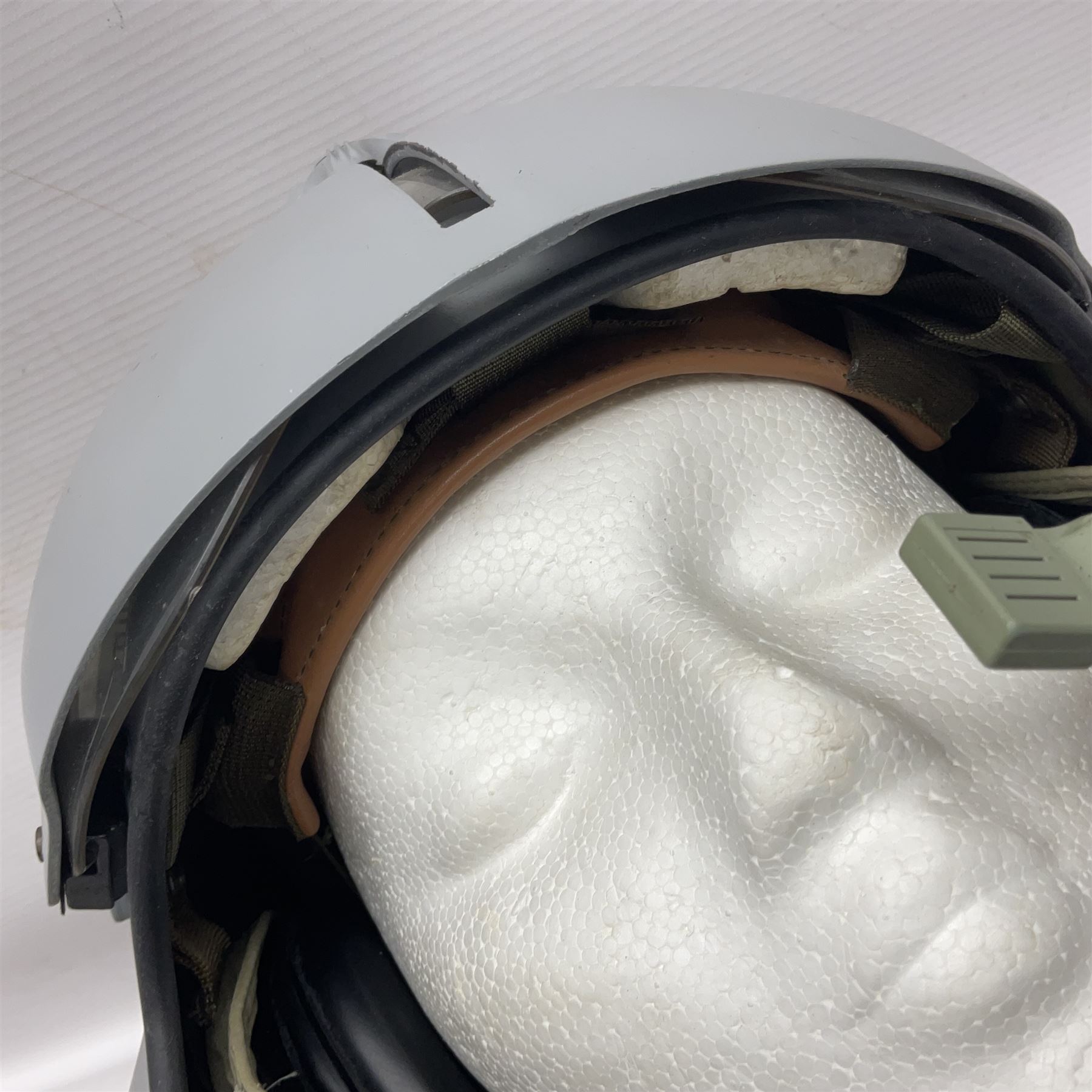 Silver grey SPH-4B Flight Helmet as used by helicopter pilots in the USAF and US Army in the 1990s; made of epoxy resin reinforced fibreglass; fitted with clear and tinted visors and complete with an M-87A/AIC boom mike; original condition and bench tested.