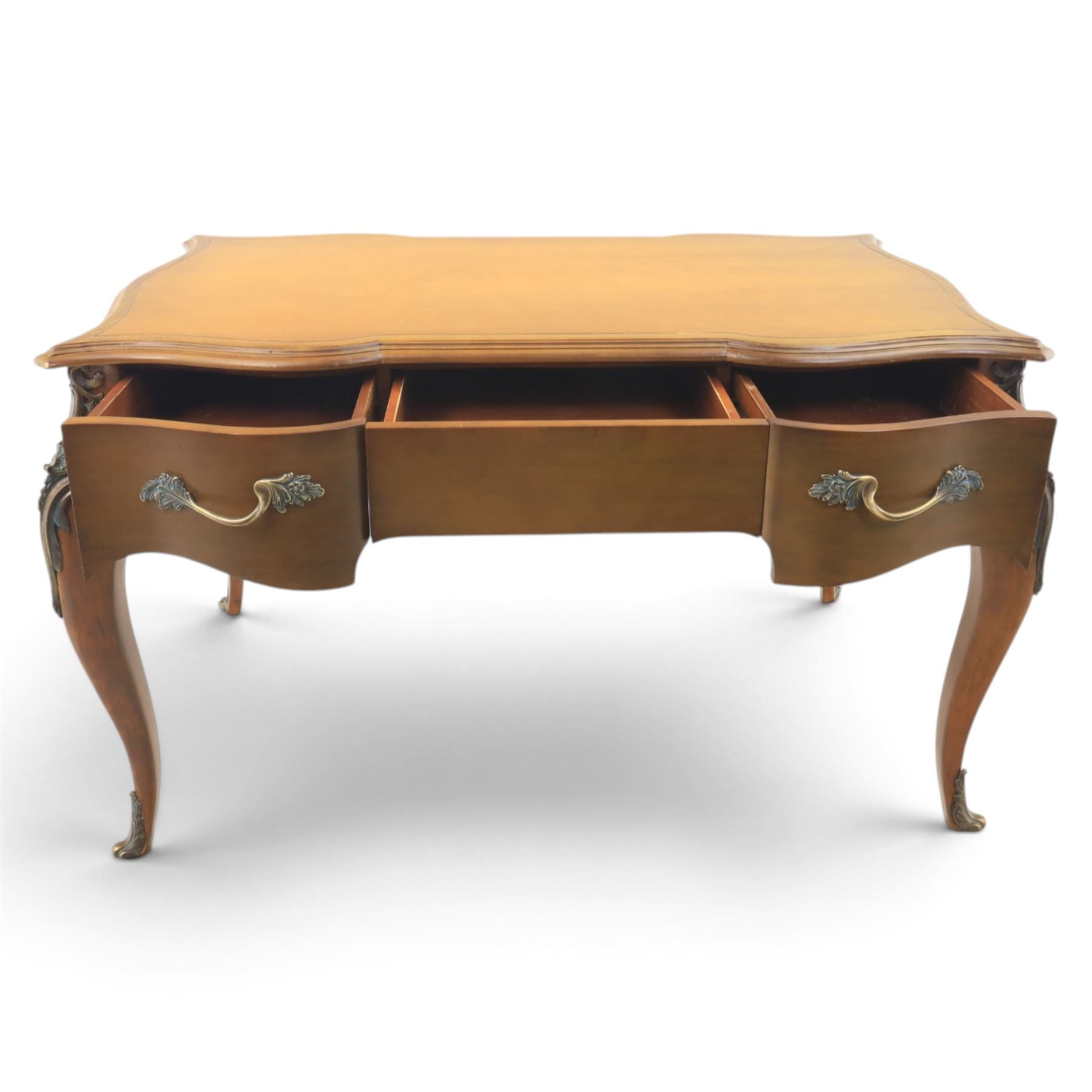 And So To Bed - Cherrywood serpentine dressing table, two drawers with brass handles foliate design with applied gilt mounts, raised on cabriole legs with gilt caps