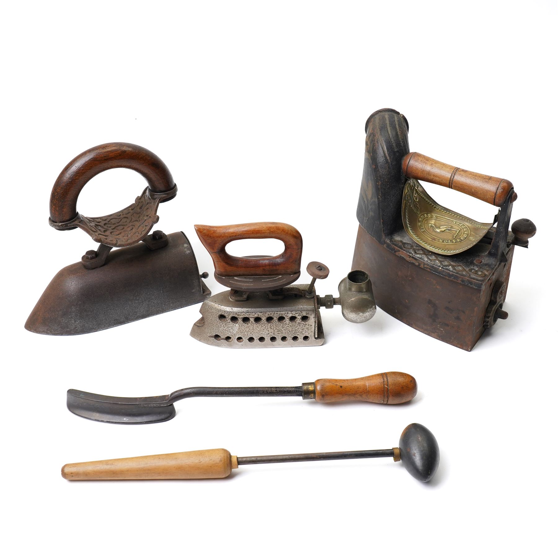 Chimney iron by Crane of Wolverhampton ,Feldmeyer type flat iron with spirit tank, another flat iron, hatters flooster iron and one other milliners iron (5)