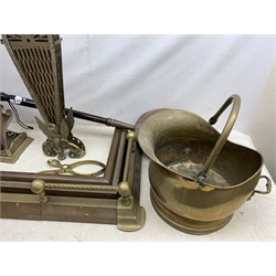  A brass fire curb, together with a copper example, two brass fireside companion sets, a brass coal bucket and tongs, copper warming pan, etc.   