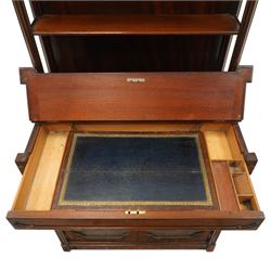 Late 19th century Gothic Inspired secretaire-chiffonier, the raised superstructure with two open shelves and cluster-column uprights, the base fitted with hinged top over secretaire drawer with hinged slope writing surface and pen-rest compartments, over a twin glazed doors enclosing single shelf, the flanking cluster-columns on skirted base