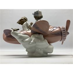 Lladro figure, Don't Look Down, modelled as a girl and boy in a plane, sculpted by Joan Coderch, no 5698, year issued 1990, year retired 2004, H17cm