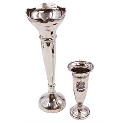 1920s silver trumpet vase, with shaped rim and knopped stem, upon spreading filled foot, H23cm, hallmarked Marson & Jones, Birmingham 1927, together with a smaller example, of faceted form, with dart rim and applied enamel crest, with 'S.S.Orford' inscribed on enamel plaque below, upon stepped filled foot, H12.5cm, hallmarked Mappin & Webb Ltd, Birmingham 1928