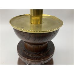 Pair of Arts and Crafts turned oak candlesticks with brass mounted sockets and drip pans, H19cm