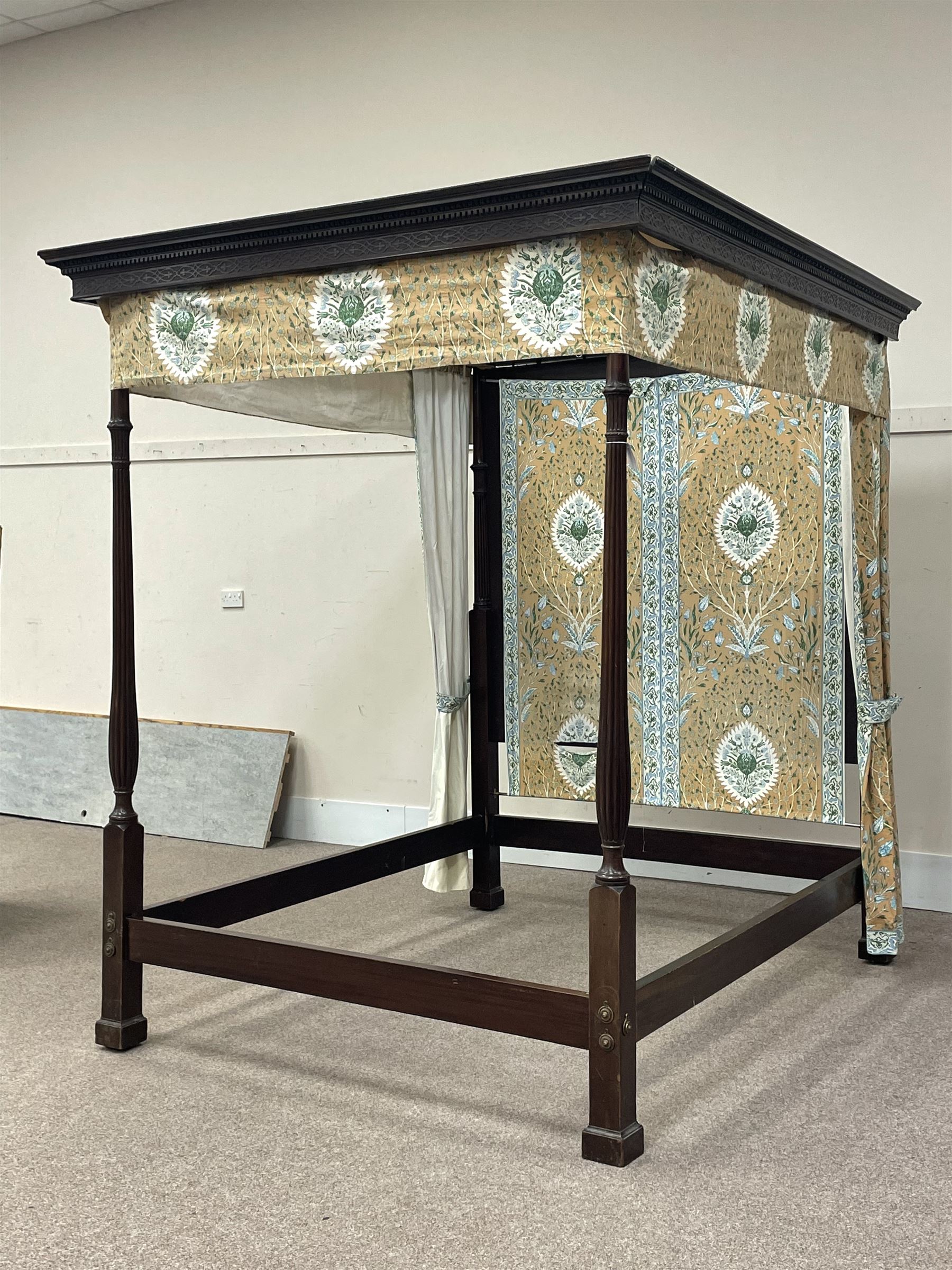 Early 20th century Chippendale style mahogany four poster bed, projecting dentil cornice with egg and dart mouldings and blind fretwork frieze, tapering reeded supports, with bed base