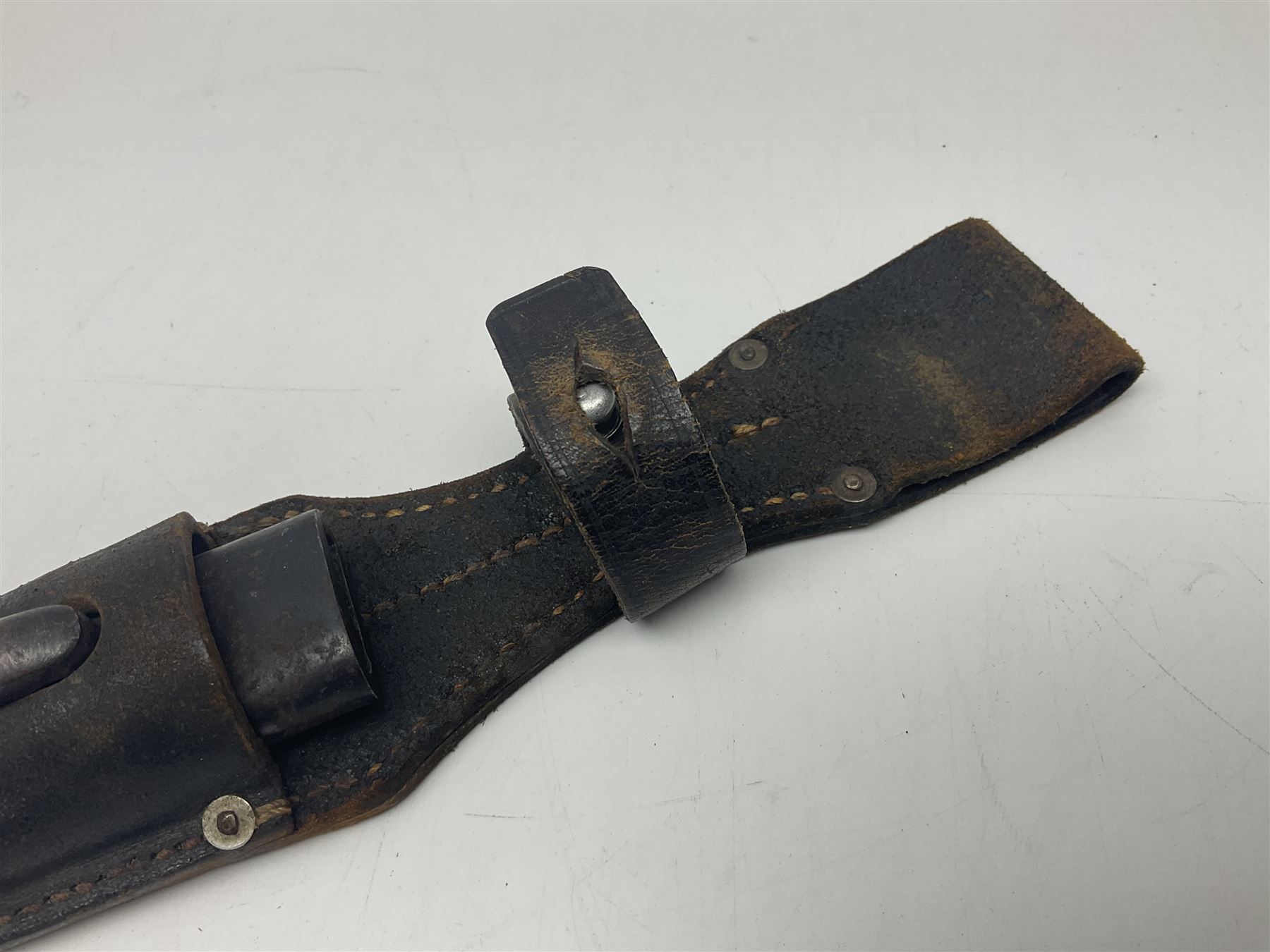 WW2 Italian Model 1891 bayonet with 30cm fullered blade; cross-piece marked PS 1941; in associated leather covered scabbard with frog L45cm overall