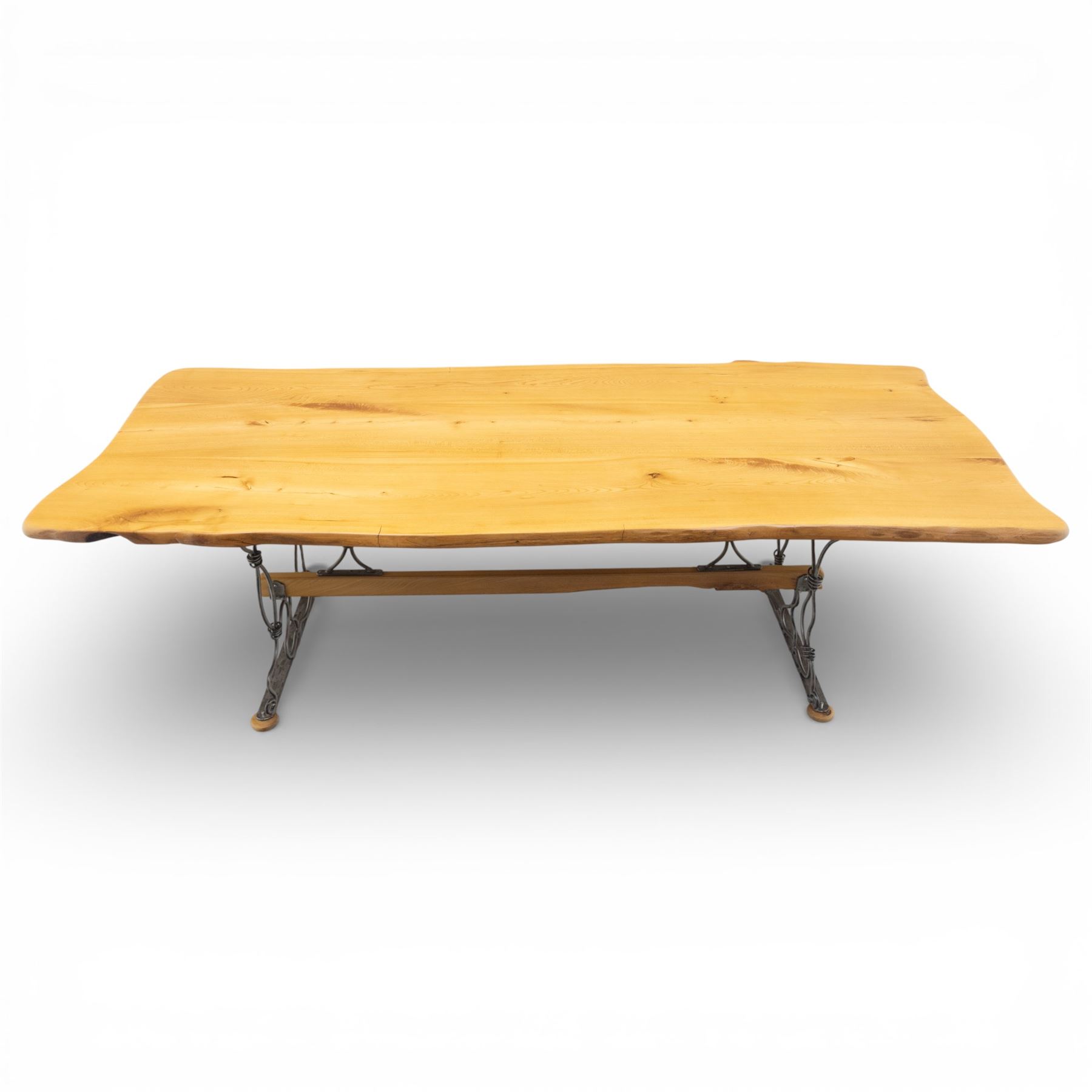 Paul Hodgkiss Designs of Glasgow - contemporary shaped elm dining table with wrought iron base; with set ten (8+2) matching high-back dining chairs, table of organic form above an elaborate wrought iron supports, with central elm stretcher, the chairs with en suite with matching wrought iron work burred elm headrest, purple velour upholstery with drop in seat     

Table: W 102cm, L 243cm, H 74cm
Chairs: W 56cm, D 52cm, H 130cm