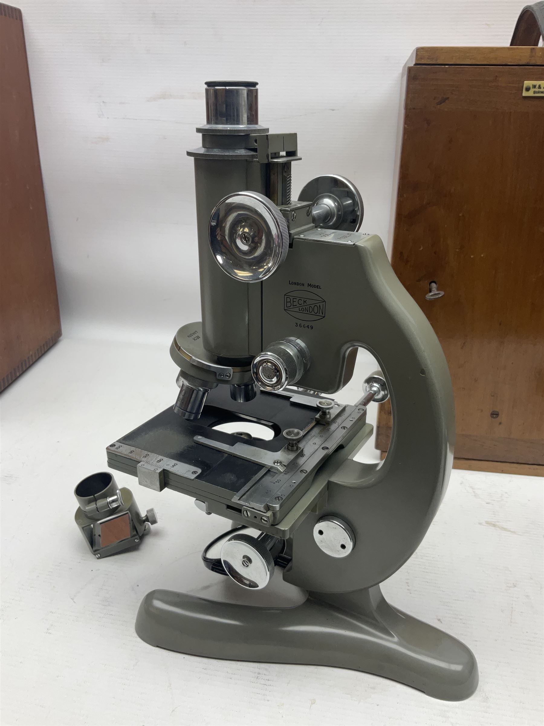 Four microscopes, including Cooke, Troughton & Simms no M467926, W Watson & Sons no 114758, W & J George & Beck Ltd no 36649 and one other 