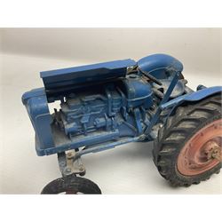 Chad Valley - two unboxed and playworn large scale Fordson tractors - No.9235 Fordson Major Tractor, dark blue diecast body, orange wheels, crank handle clockwork mechanism and 'Firestone' rubber tyres; and No.M59 New Fordson Major Tractor, blue diecast body, tinplate hinged bonnet, orange wheels and clockwork motor contained in rear wheel hub (2)