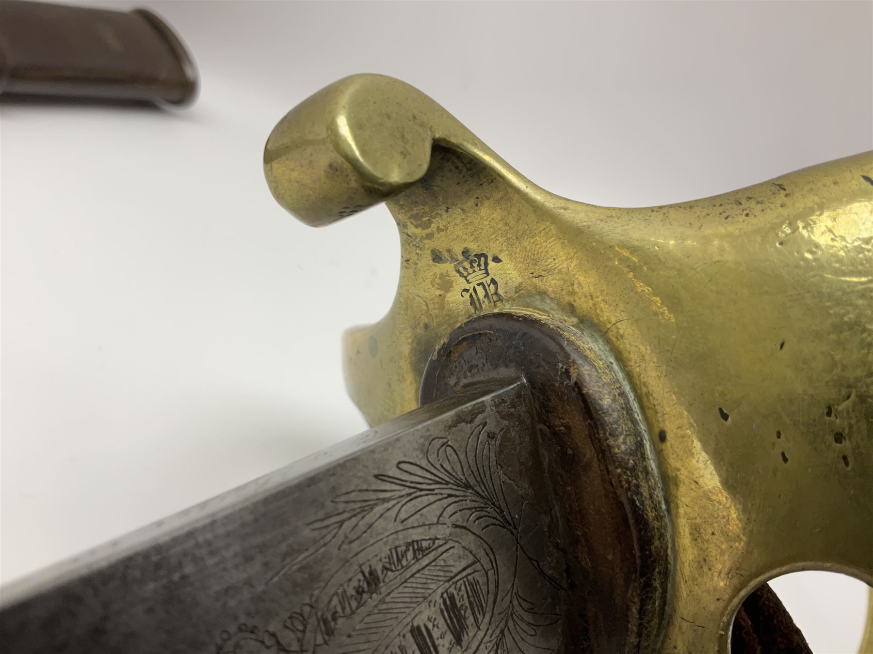 19th Century German (Saxony) Cavalry Sword, the 90.5cm single edge curved steel blade with narrow fuller to the back edge at each side, engraved with a crowned AR monogram and coat of arms, stamped with crowned AR, the back edge engraved C.v Keller im Solingen 1862, the brass half basket hilt with three flat curved bars, applied badge missing, marked G.R. 4, with ribbed leather covered grip and leather finger strap; in steel scabbard with two fixed suspension rings to one side and stamped G.R. II 118; L109.5cm overall