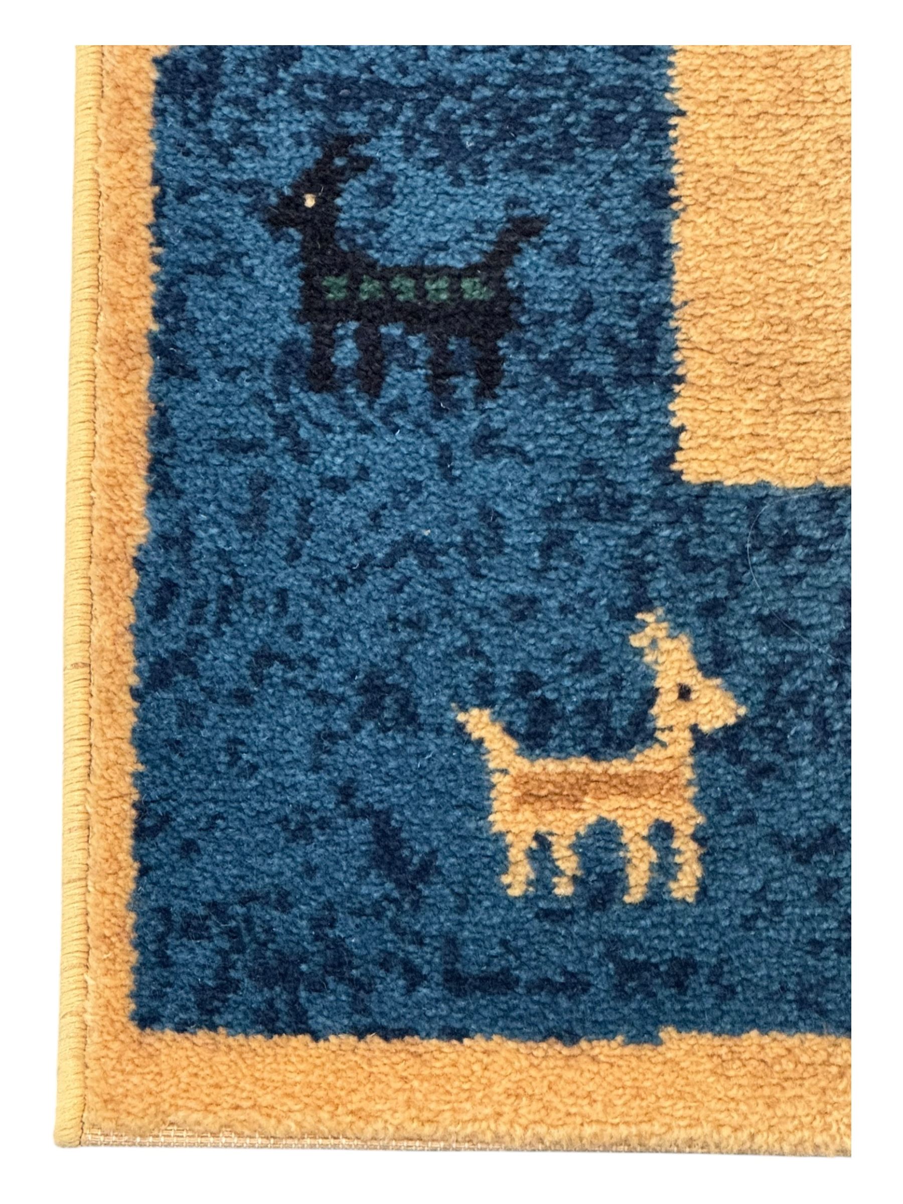 Contemporary 'Royal Garden' wool pile rug, central cream field with a smaller red rectangular panel containing scattered animal and geometric motifs, bordered by a wide indigo band decorated with stylised figures, animals, and tree motifs
