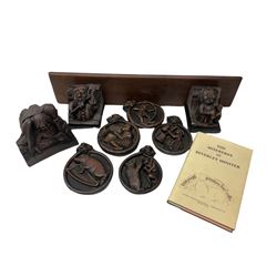 Seven Replicas of carvings in the medieval choir stalls of Beverley minster by Oakapple designs, together with a book The Misereres of Beverley minster