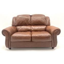 Violino three seat sofa upholstered in chestnut leather, turned supports (W207cm) and matching two seater (W155cm)
