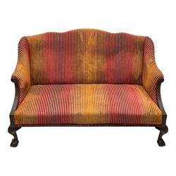 Mid-19th century mahogany two-seat sofa, upholstered in striped velvet fabric, the shaped backrest leading to outward-curved arms, carved apron with scrolling foliate details, raised on cabriole supports terminating in claw and ball feet