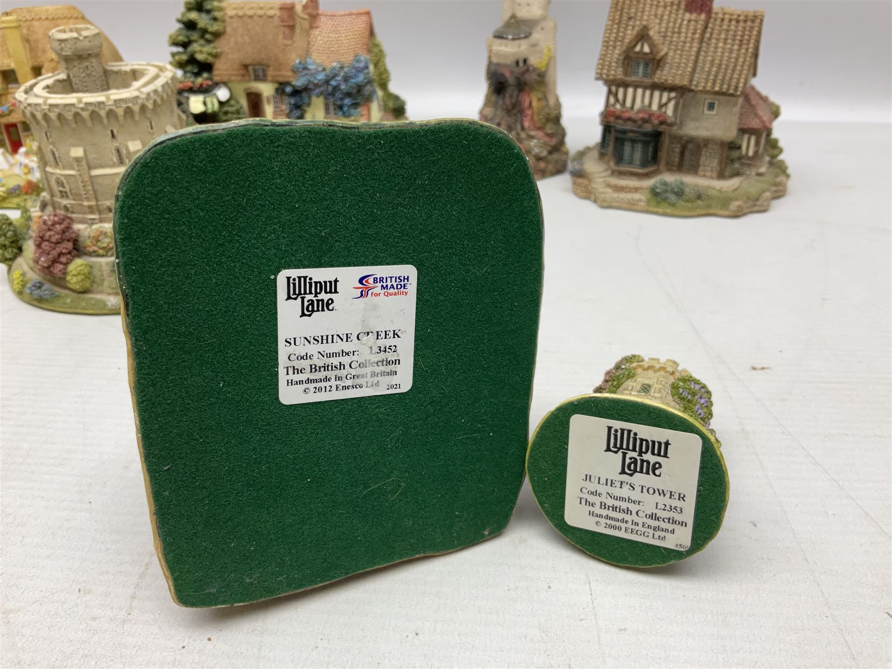 Sixteen Lilliput Lanes, to include The Golden Jubilee, Round Tower - Windsor Castle, Castle of the Golden Chalice, Travellers Rest, with box and deed,  Summer Days, Sunshine Creek, Writing with Lewis Carol, with box and deed,  etc 