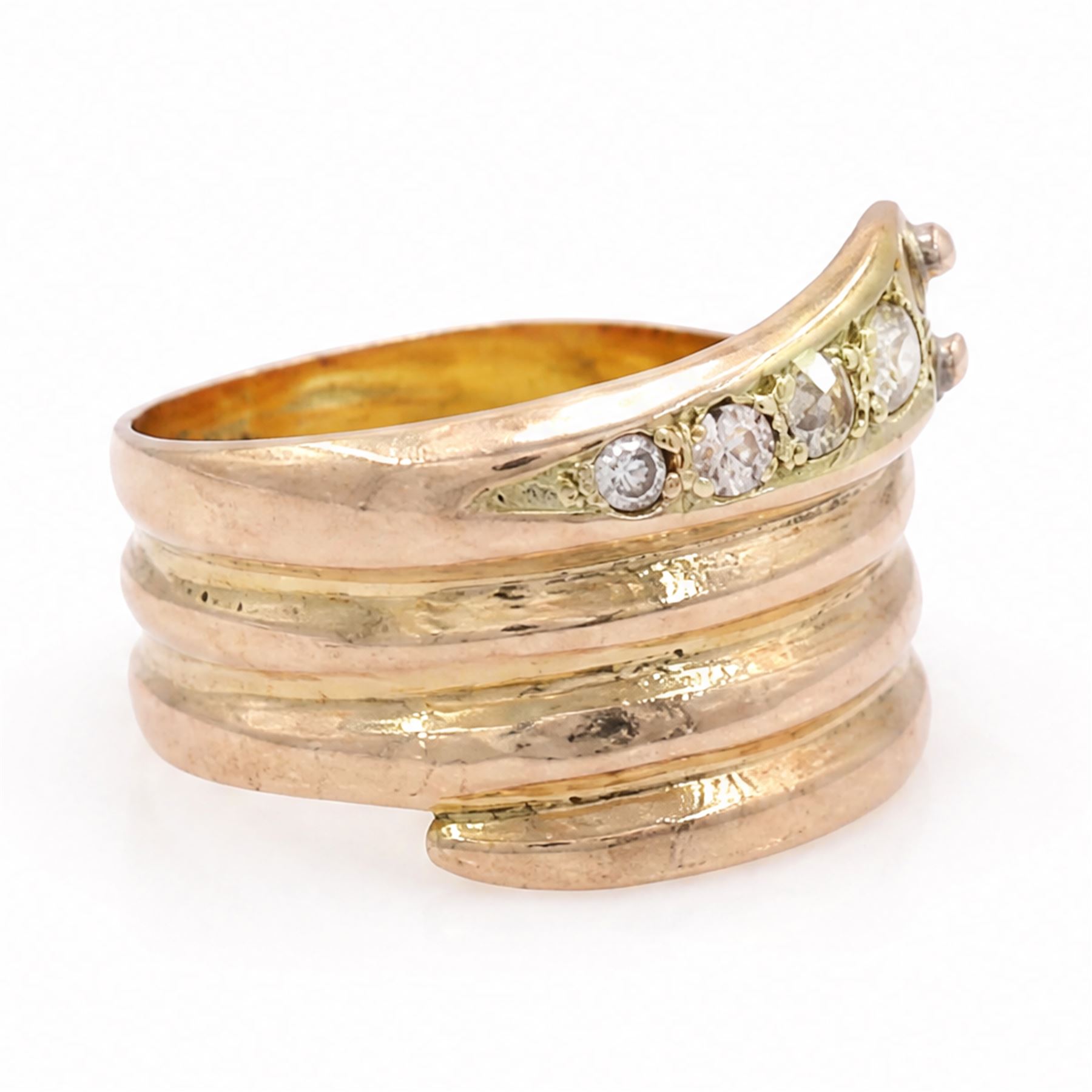 19th / early 20th century 9ct gold diamond coiled snake ring, the head set with four graduating old cut diamonds