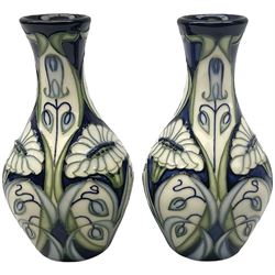 Pair of Moorcroft vases, of waisted baluster form, decorated in the Rain Daisy pattern designed by Rachel Bishop, with impressed and painted marks beneath, and dated 2004, H13.5cm. 