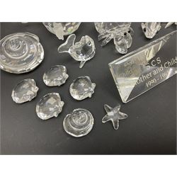 Nineteen Swarovski Crystal sea creatures, to include dolphins, seals, puffer fish, octopus, crabs, together with a quantity Swarovski Crystal shells 
