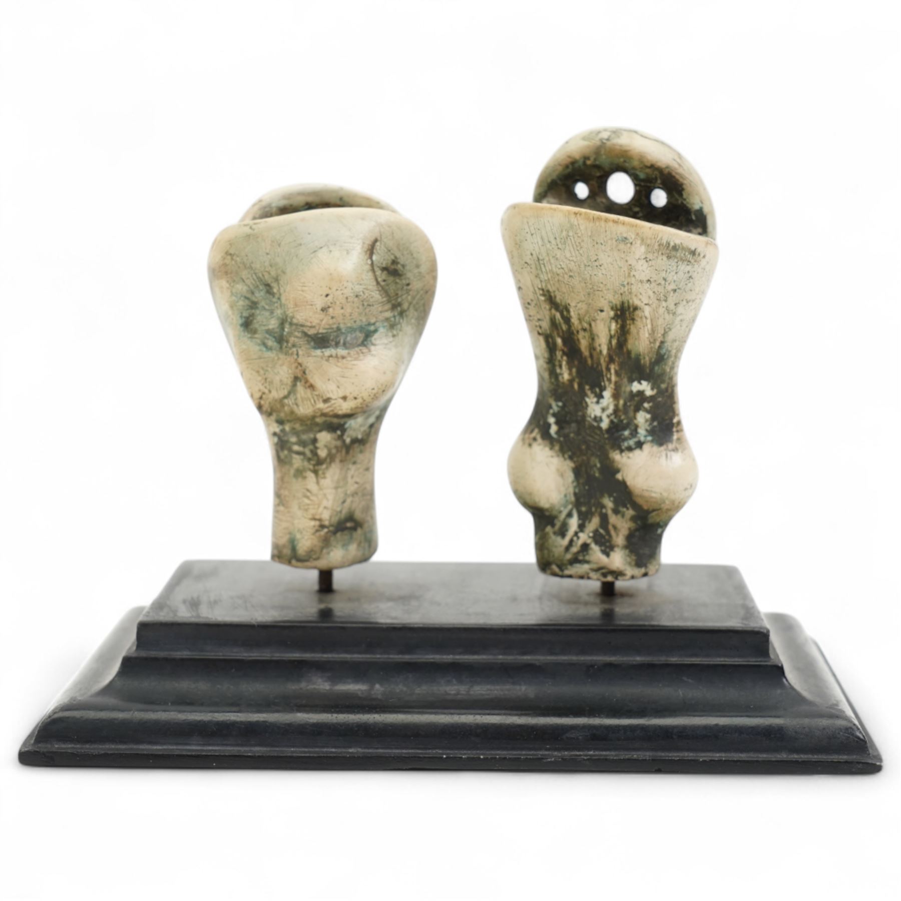 After Henry Moore (British 1898-1986): 'King and Queen', plaster maquette sculpture, base marked with affixed catalogue label inscribed 'King and Queen: 1952 Archive 0067285', W11cm H8cm
Notes: likely head studies for the large 'King and Queen' sculpture