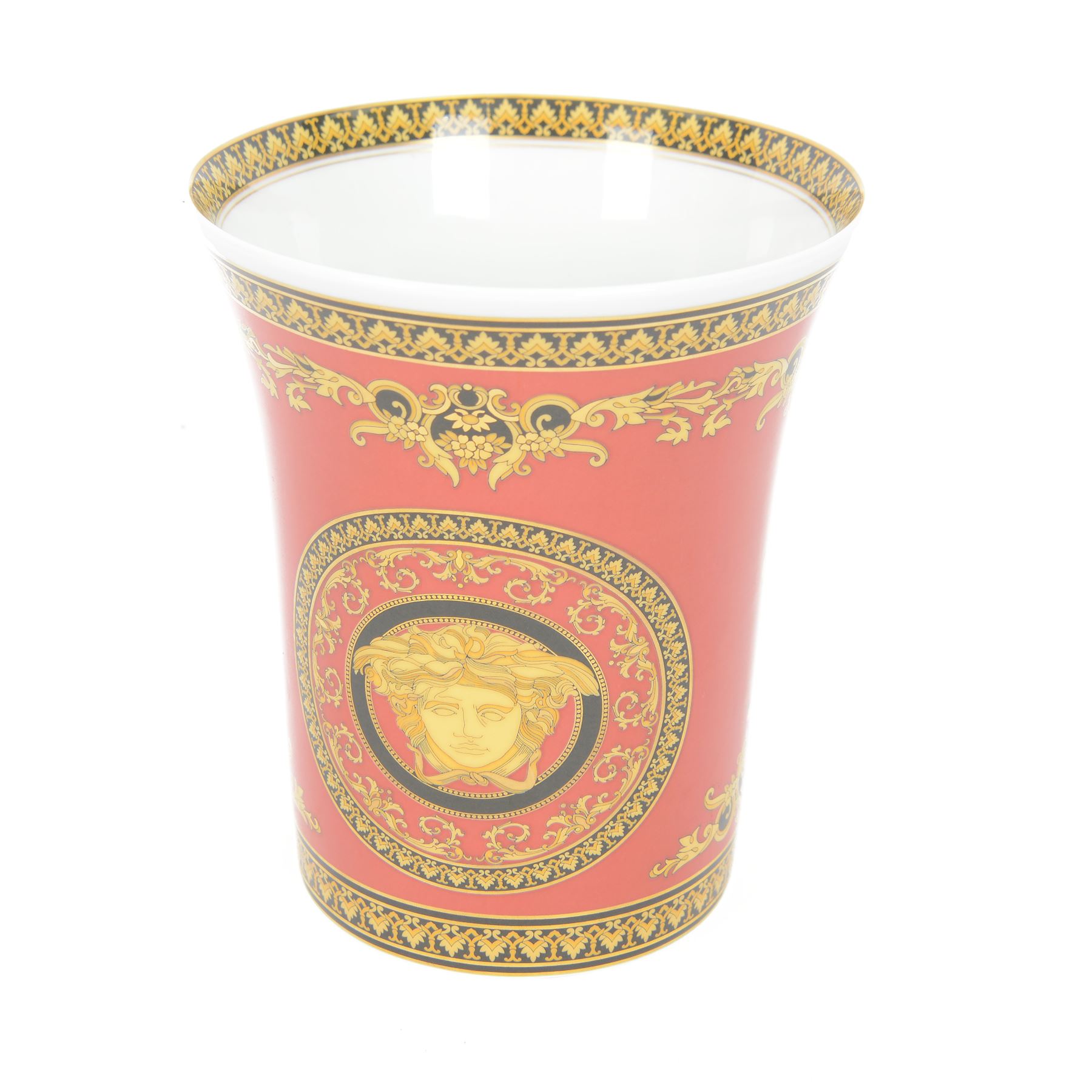 Rosenthal Medusa Versace vase, featuring a gold-shaded Medusa head surrounded by baroque details upon a red ground, H18cm 
