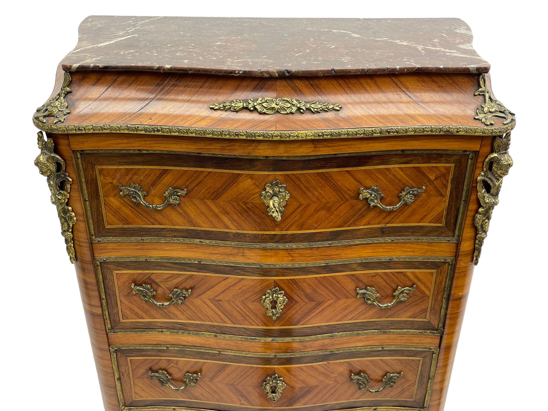 Mid-20th century Louis XVI design Kingwood and walnut secretaire à Abattant, shaped serpentine form with dark rouge variegated marble top, the fall front disguised as three drawers enclosing birdseye maple interior with shelf, drawers and writing surface, four functioning drawers below, decorated with cast gilt metal mouldings and mask cartouches, on skirted base with egg and dart moulded gilt metal edge