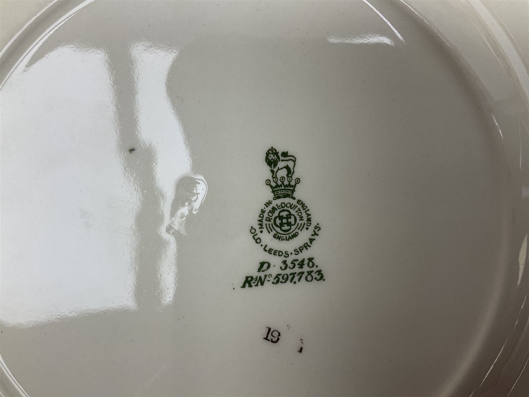 Royal Doulton part dinner service in Old Leeds Sprays pattern,  to include cheese dome, teapot and stand, egg cups etc, together with a selection of floral doilies.  