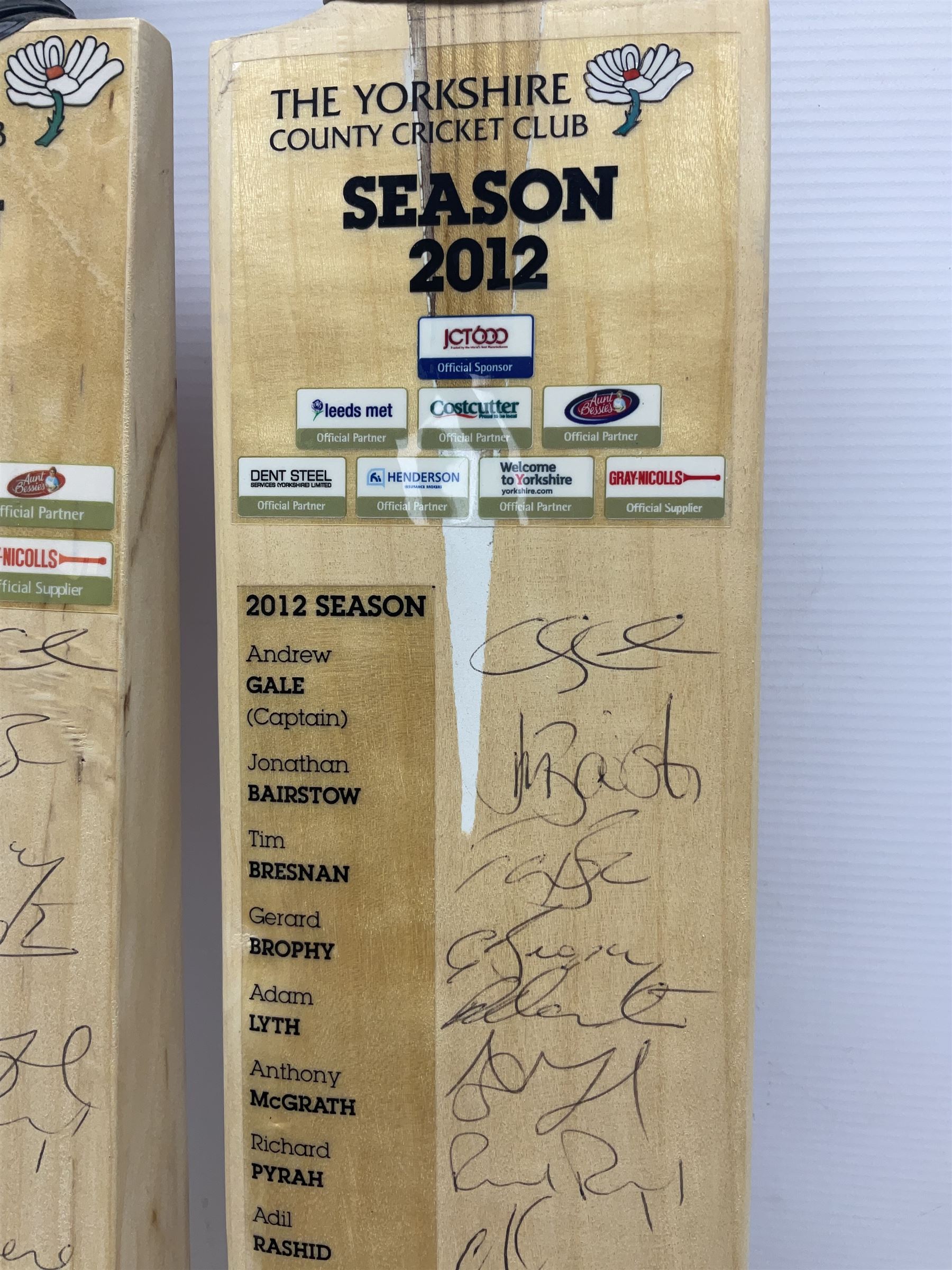 Two signed Yorkshire County cricket bats, from 2011 and 2012 seasons, bearing signatures including Adil Rashid, Andrew Gale, Ryan Sidebottom, Gary Ballance etc