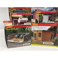 Hornby '00' gauge - thirteen Skaledale trackside buildings/accessories including R8737 Small Gasholder, R9653 Baptist Church, R8542 Holly Farm Workshop, R8534 Signal Box, R8854 Fan Drift, R8525 Holly Farm Stables, R9531 Magna Waiting Room, R8778 Fan House, R8709 Fuel oil Tanks etc; all boxed (13)