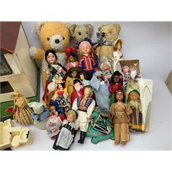 Mock Tudor style two storey dolls house with wood and plastic accessories and furniture, quantity of dolls and three stuffed teddy bears