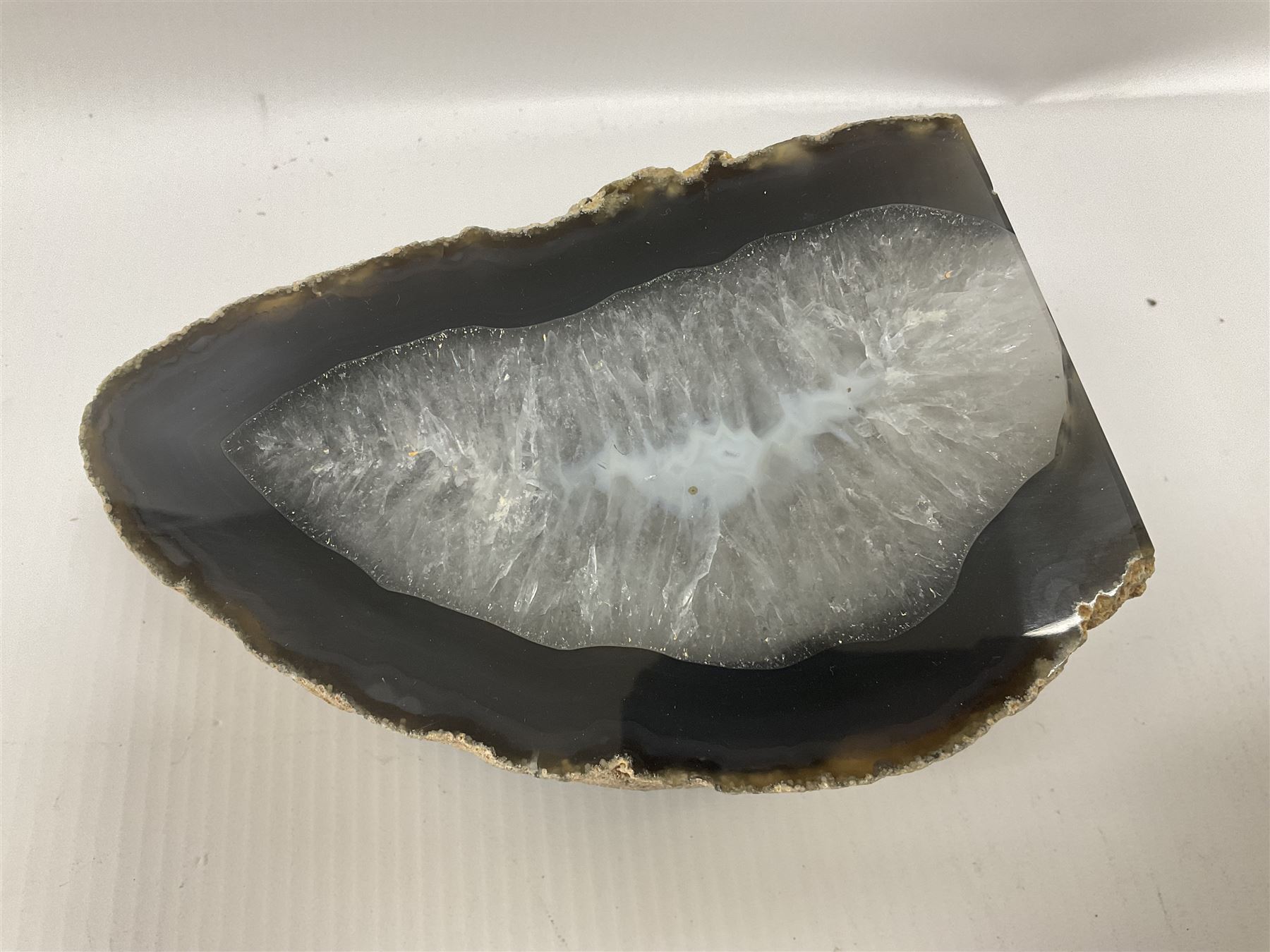 Four polished blue agate geodes, largest H10cm, L18cm