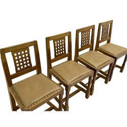 'Rabbitman' set of eight oak dining chairs, pierced lattice backs, upholstered seats with studwork band, octagonal front supports joined by stretchers, carved with rabbit signature, two carvers and six side chairs, by Peter Heap of Wetwang